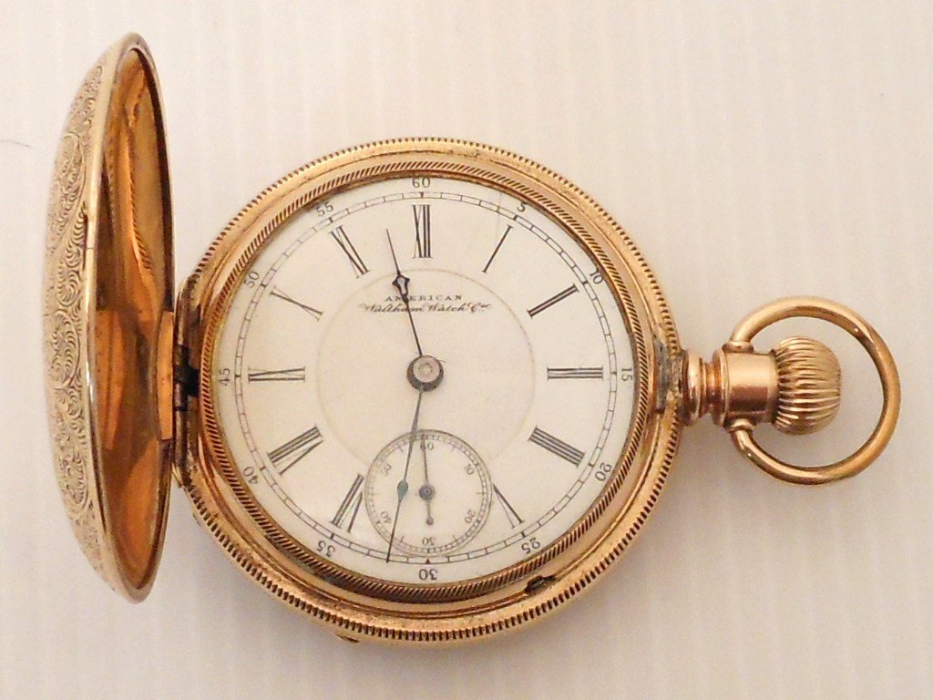 American Waltham Double Hunter Case Pocketwatch: American Waltham Co. heavily engraved double hunter case with a dust cover, circa Dec 1891- Feb 1892, serial #5143394, model 1883, no. 15, size 18, 15 jewel, working condition with a cracked crystal