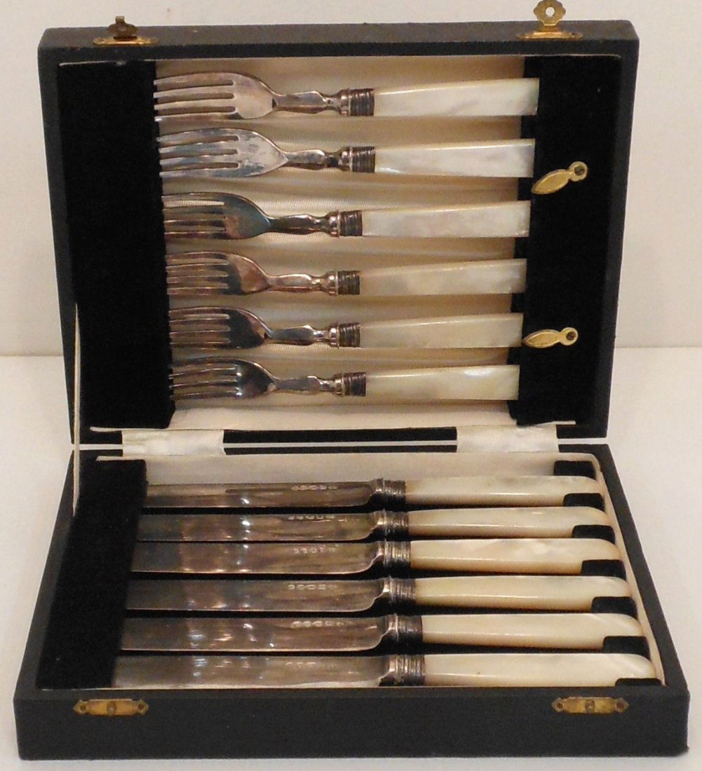 Fork & Knife Set Mother Of Pearl Handles with Case: Set of six silverplate forks and knives with mother of pearl handles, marked, in used condition, leather covered latched case