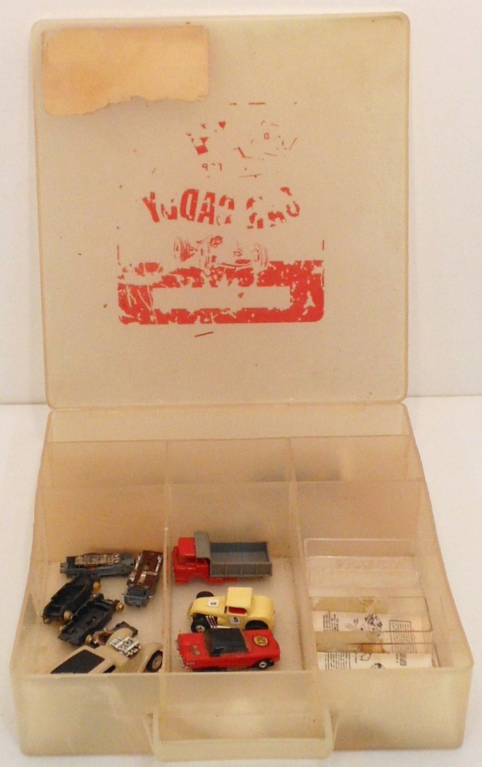 HO Scale Car Caddy With Cars and Accessories: Aurora HO Customized T-Bird, rear is raised. TJet Hot Rod Coupe. Both used cars tested in working condition, contacts were cleaned. A Dump Truck body and convertible body. A few chassis, paperwork, a