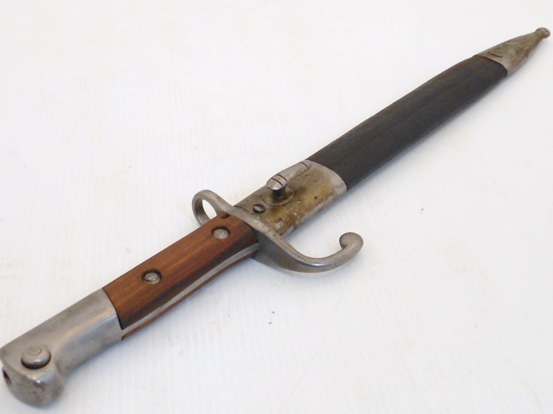 Brazilian 1908 Mauser Bayonet with Scabbard: 16 7/8" total 11 3/4" blade and a 5 1/8" hilt, Brazilian Model 1908 Bayonet with Scabbard. Blade stamped Simson & Co. Suhl and RB in a circle on the blade edge, Crossguard marked serial # 5887. Wood g
