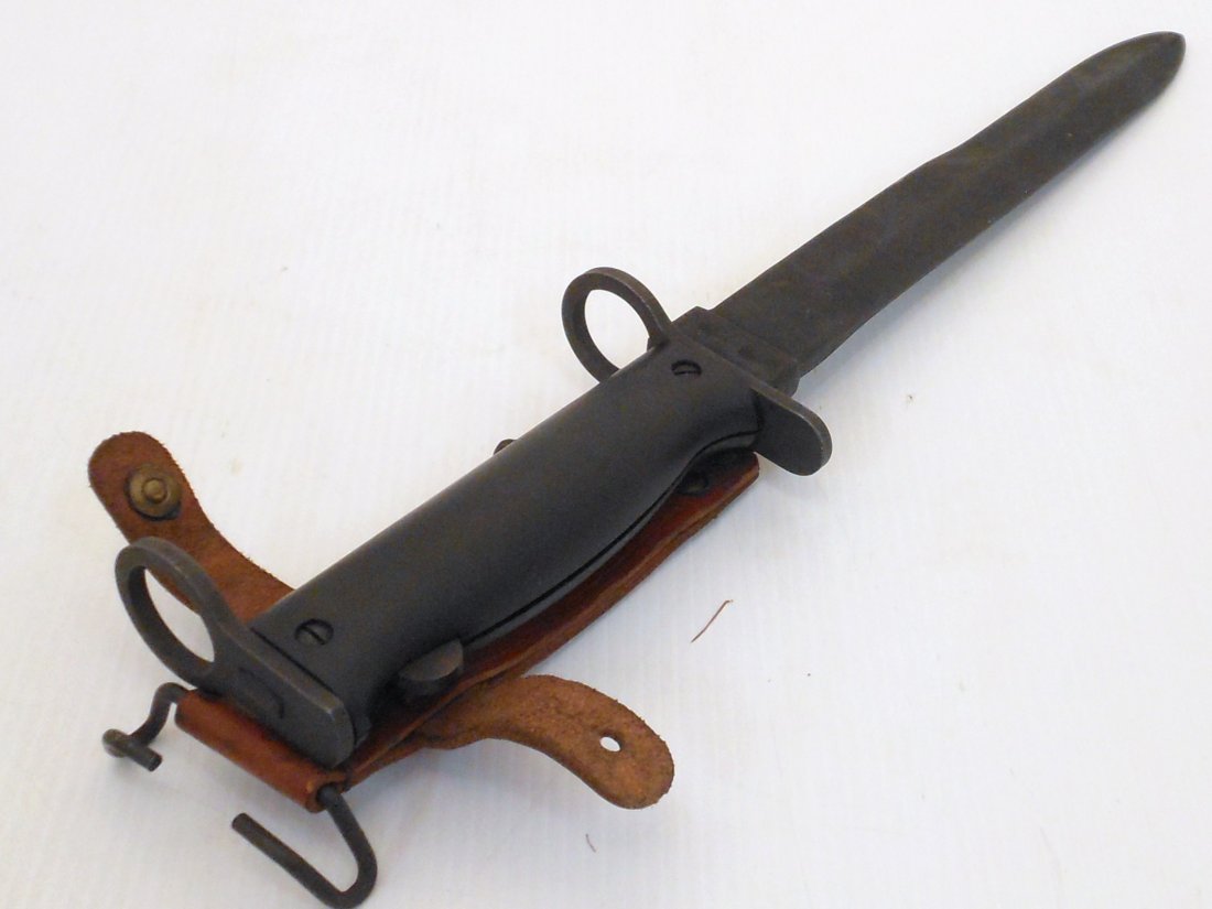 French MAS 49/56 Bayonet with Scabbard: 13 1/2" total 8 1/2" blade and a 5" hilt, French Assault Rifle Bayonet fits MAS 49/56 Rifle, parkerized finish with a black composite grip, metal scabbard/leather belt hanger, both in excellent condit
