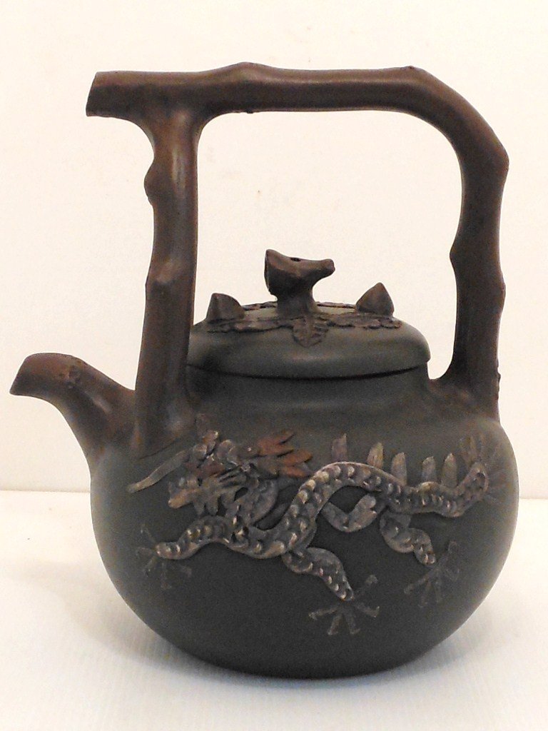Qing Dynasty Bamboo Basket Yixing Clay Teapot: 10" tall X 8 1/2" wide, Large teapot decorated with a Dragon and Phoenix, lid has a flora motif, marked, unused in Excellent condition.