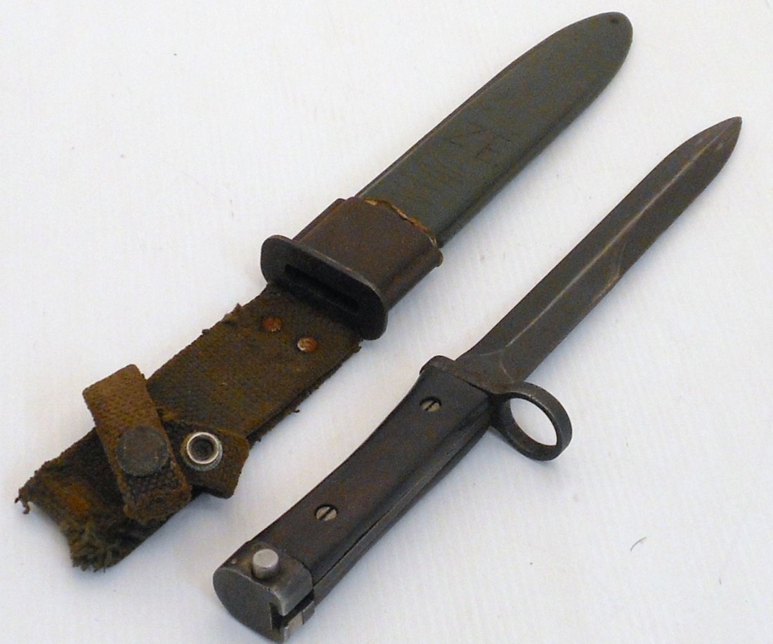 Portugal AR 10 Rifle Bayonet: 12" total with a 7 3/8" knife type, double edged blade, which can be used as a dagger when it is not fixed to the rifle. Made by a Dutch company Staatsbedrijf Artillerie Inrichtingen Hembrug-Zaandam (