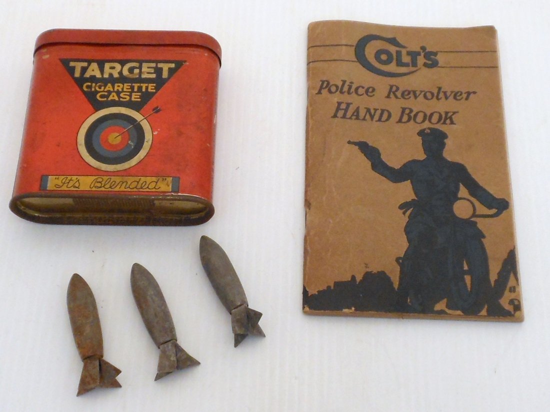 Lot of Vintage Tin Case, Handbook and Lazy Dog Bomb: Lot of three. Target cigarette case (tin), bottom has match strike, great condition with minor paint loss. Colts Police Revolver Hand Book, 40 page paperback book, circa 1920's, great condition. Three