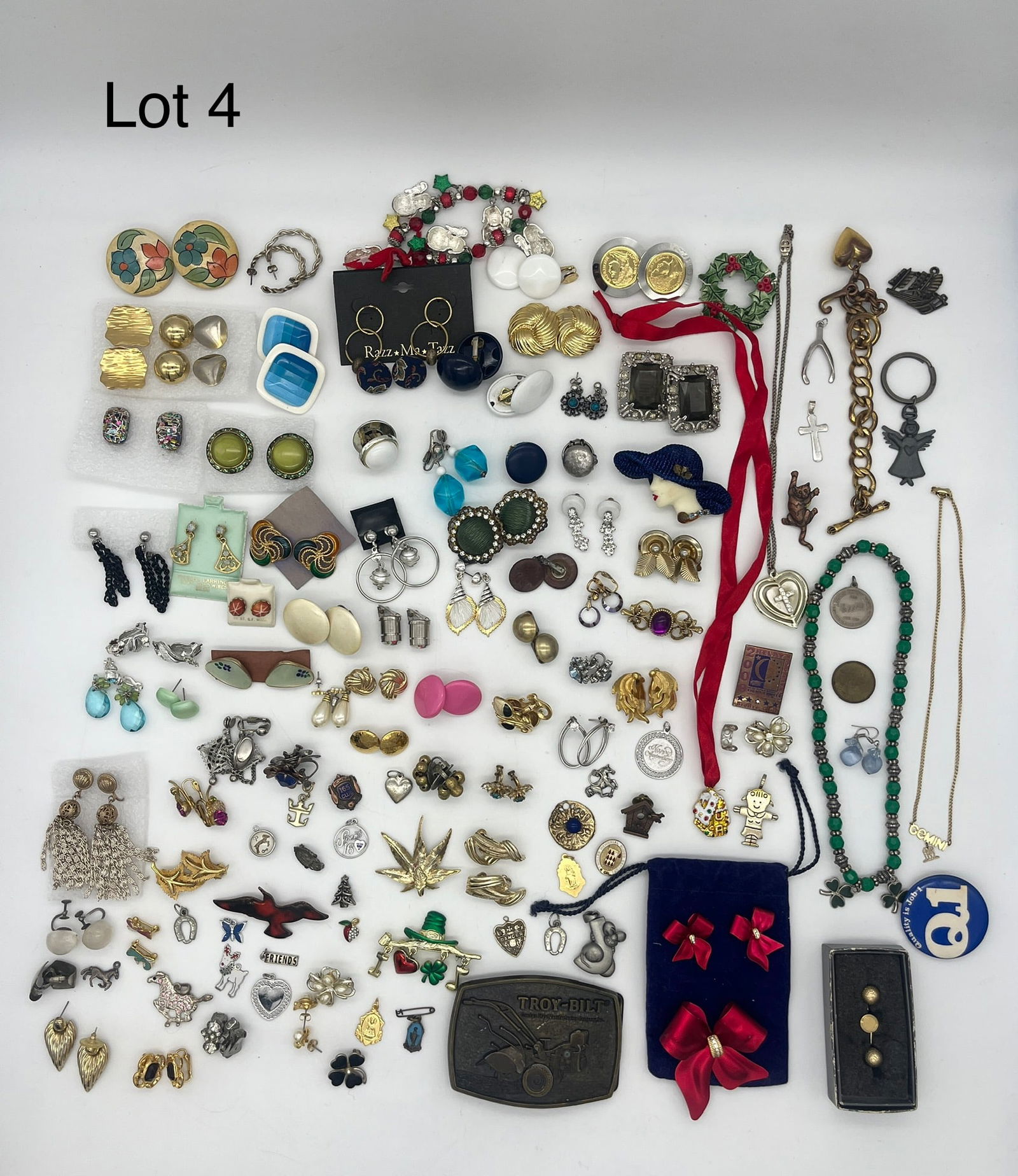 Mixed Lot of Costume Jewelry Featuring Earrings: A mixed lot of costume jewelry with a focus on earrings including clip-ons, screw backs, and piercings. Some earrings signed, with noted pieces from Coro, Kramer, and some with gold filled wires. Lot