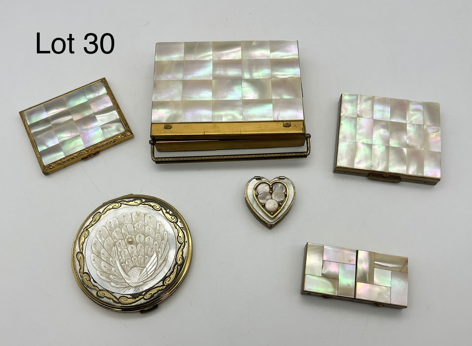 Lot of Vintage Mother of Pearl Pill Boxes and Compacts: A lot of six vintage pill boxes and compacts all with elegant mother of pearl lids and features. Four are square with similarly square tiled surfaces, though they come in different sizes and numbers o
