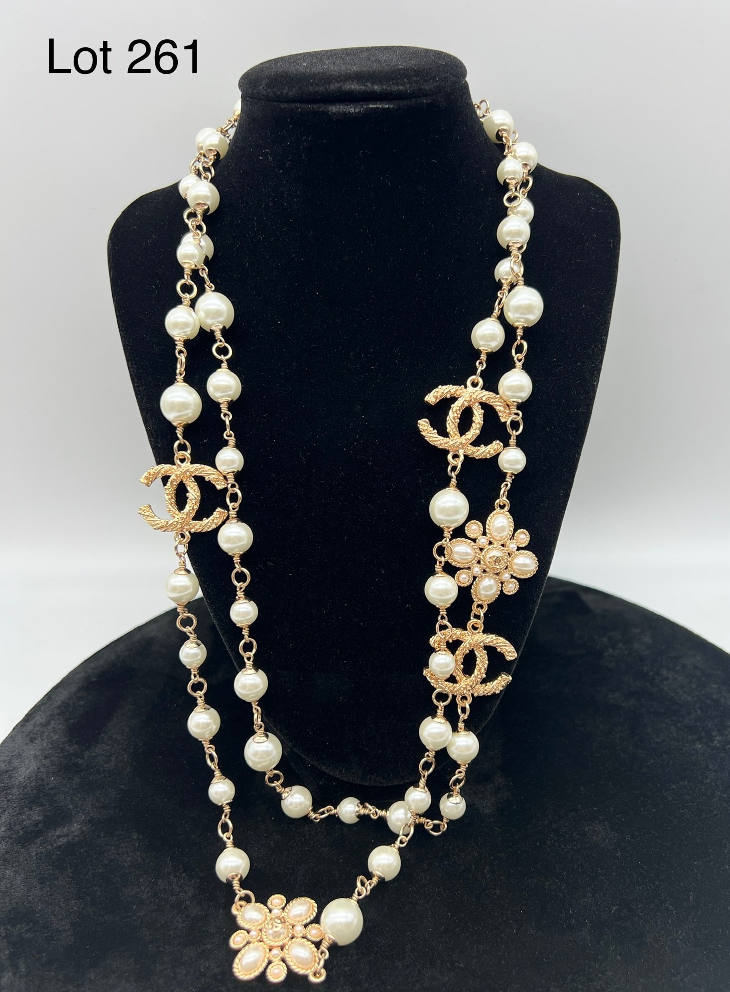 Chanel Necklace: A beautiful rose gold toned layering necklace with pearls and Chanel "CC" symbols.