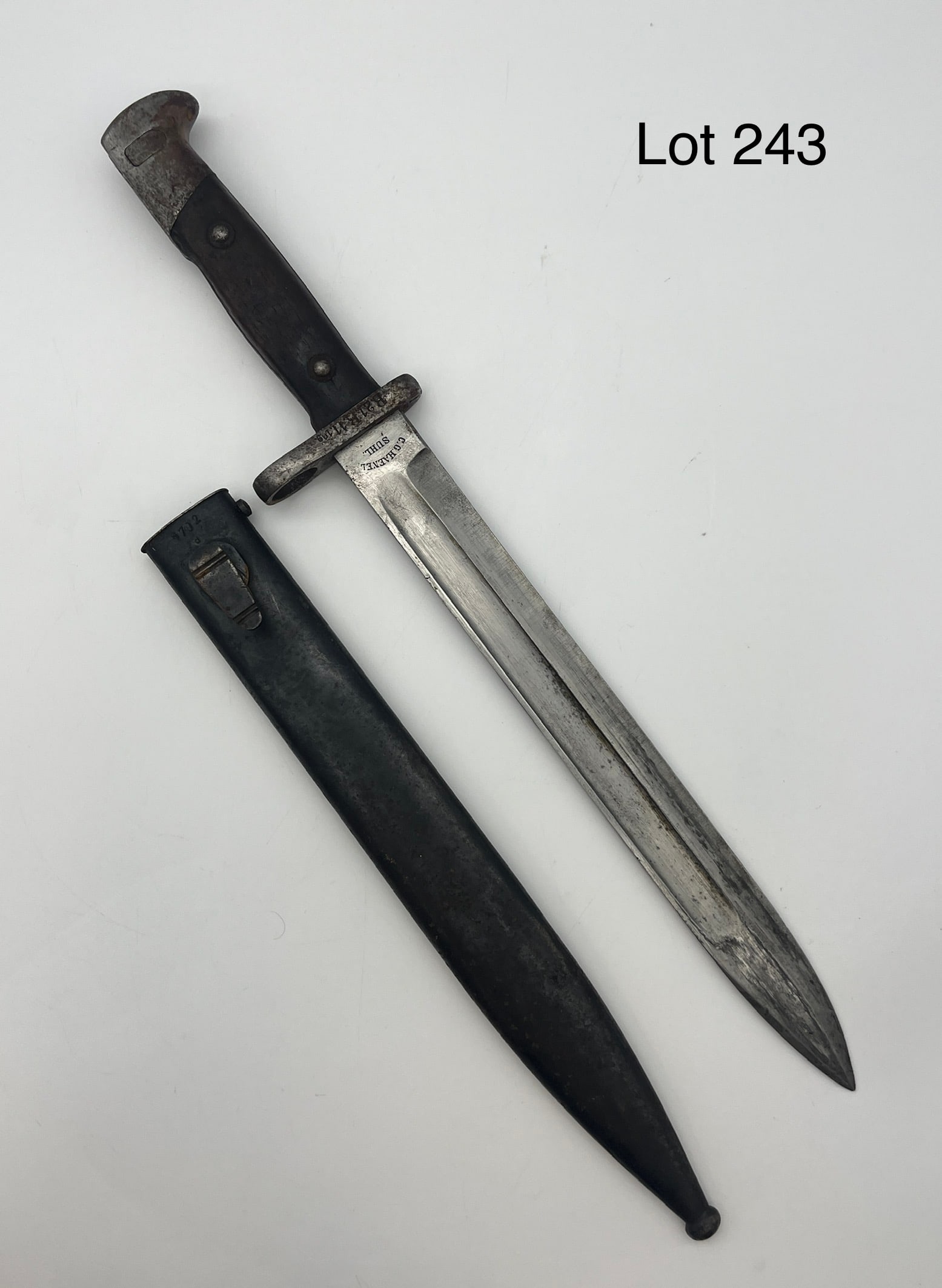 19th C. Imperial German Bayonet by C.G. Haenel: A mid-19th c. Imperial German rifle bayonet with metal sheath by C. G. Haenel, SUHL. Serial number #31130 with other marks at the guard. Blade 9 3/4", full length 15 1/2" long. *note - patina