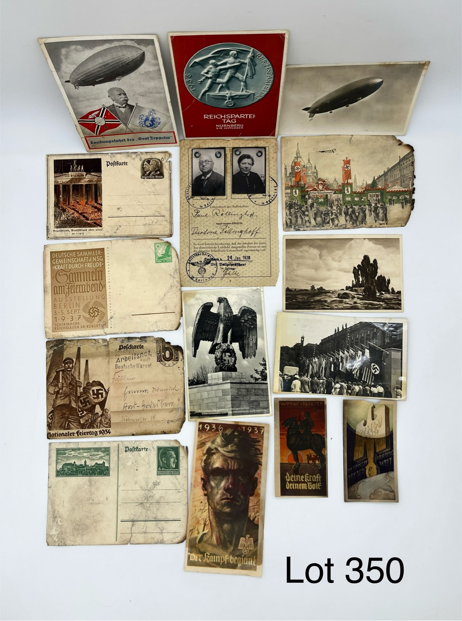 Collection of Nazi German Ephemera Featuring Postcards: A mixed collection of postcards and ephemera from Nazi Germany, much of it dating to the 1930s. Many cards show original hand written messages, original stamps, and artwork. Also includes a page from 