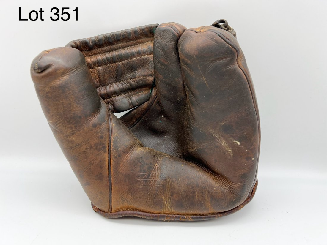 Mid Century George A Reach Baseball Glove: A mid 20th century leather George A. Reach baseball glove. Made in Philadelphia, PA. *notes- wear from age and use.