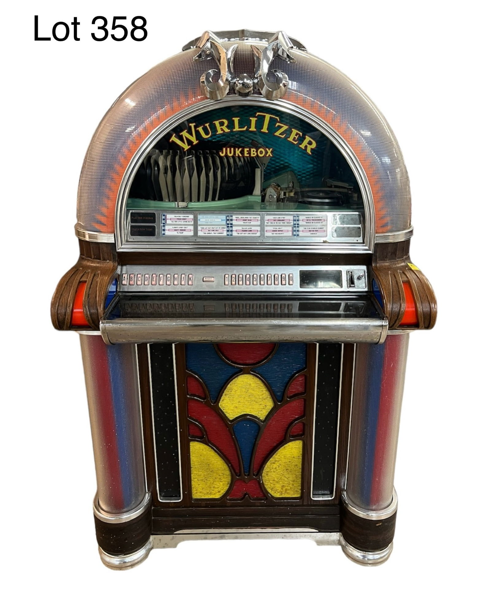 1973 Wurlitzer Jukebox Machine, Model 1050: A 1973 Wurlitzer Jukebox, model number 1050. Serial Number 816055. Key is broken in lock. Needs repair and restoration. Loaded with 45 records. Dimensions- 60" x 36" x 27 1/2" **PICK UP ONLY*