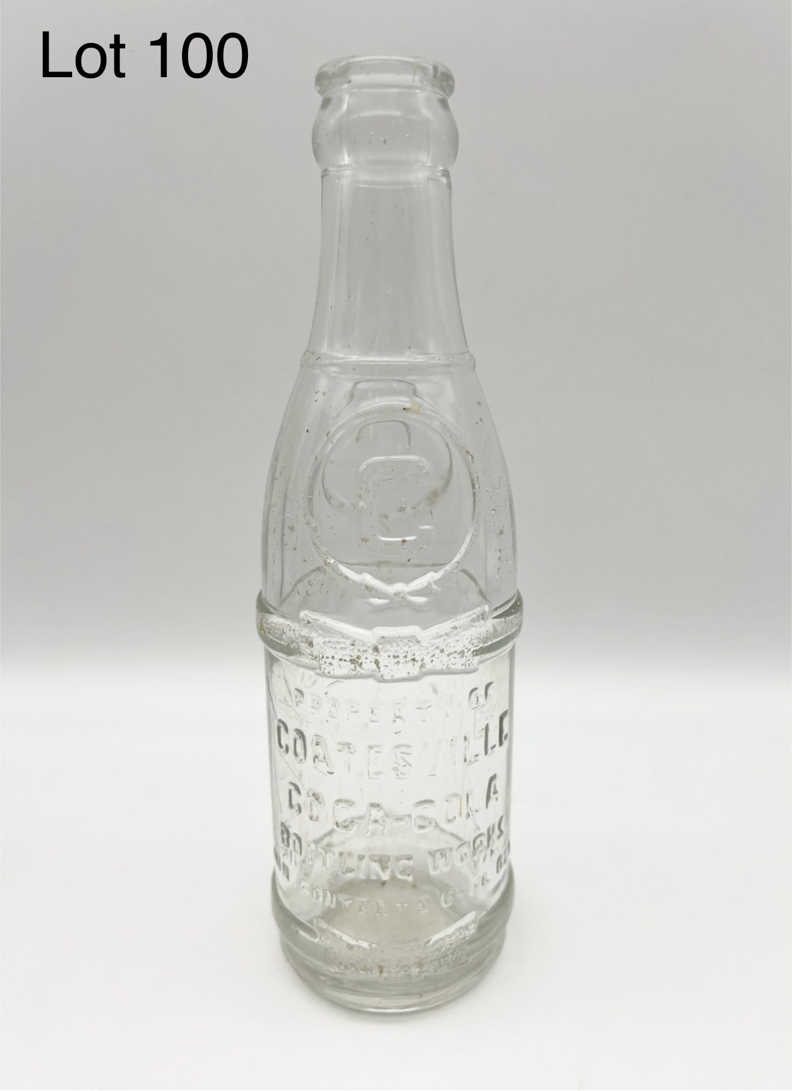 Early 20th Century Coatesville, PA Coca-Cola Bottle Works Glass Soda Bottle: A 1922 Coca-Cola glass bottle from the Coatesville, PA Bottle Works. Patent dated March 7, 1922. Bottle is 8" tall. *notes- some mild chipping.