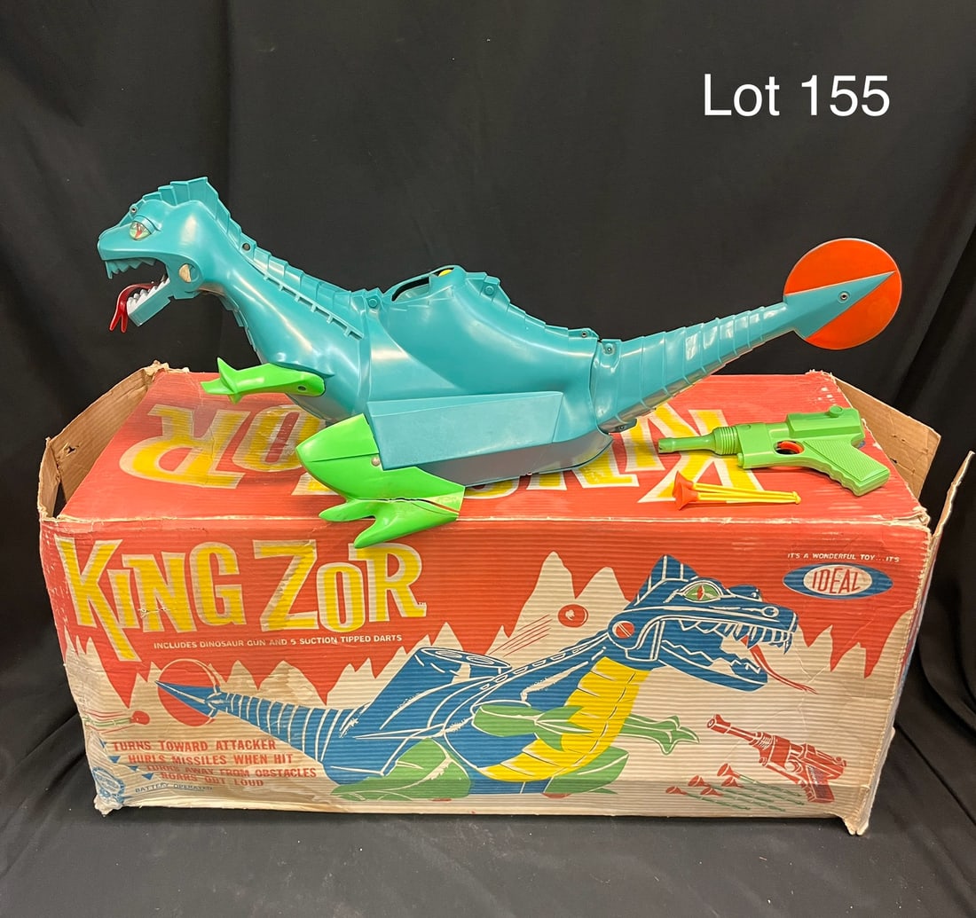 Vintage Ideal King Zor Dinosaur Toy in Box: A vintage 1962 King Zor 'The Fighting Dinosaur' by Ideal. Untested, shows original yellow balls and dart gun with two darts. Comes in original box. *note - cracking on feet, noted chip in jaw, no batt