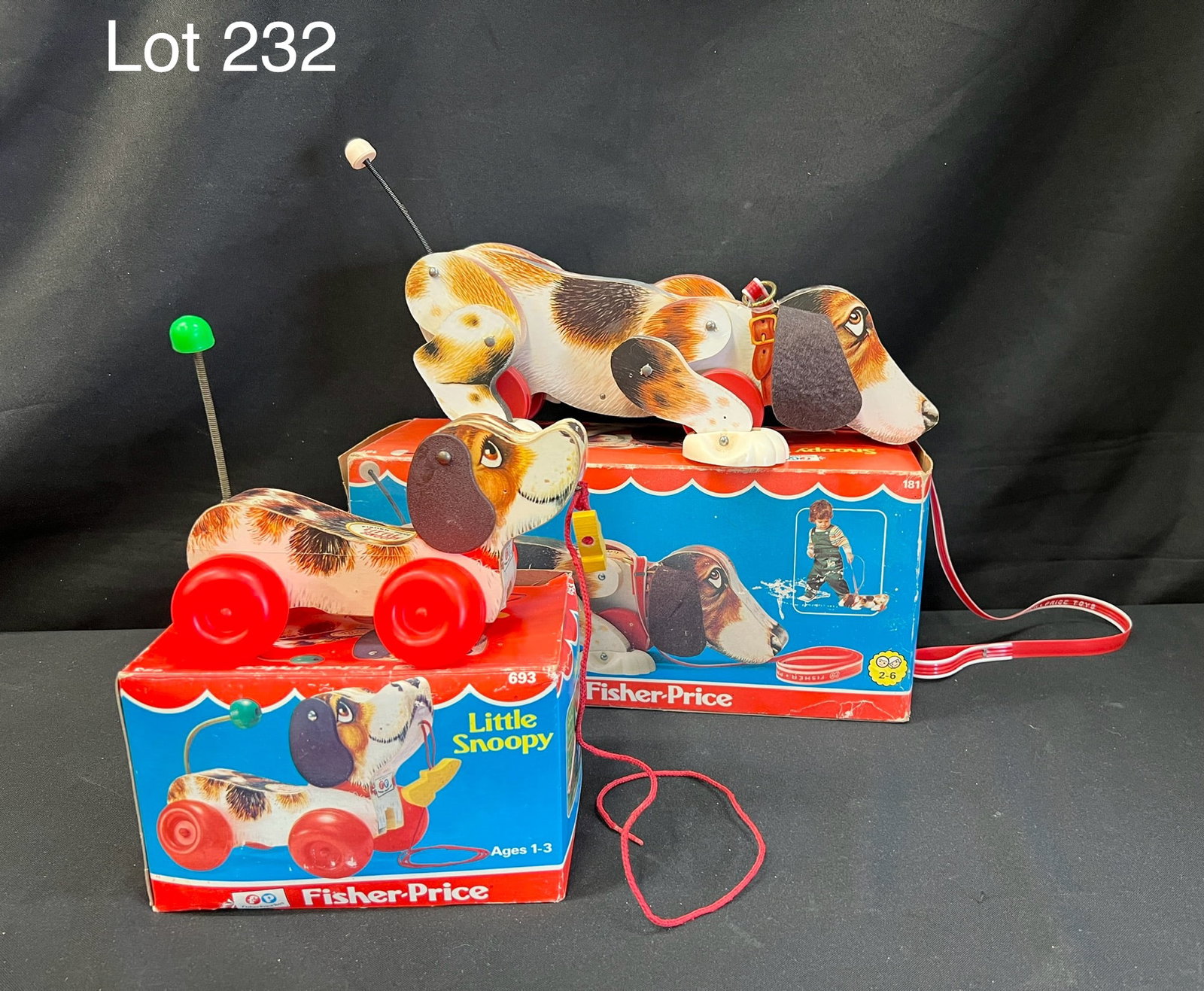 1977 Fisher Price "Snoopy Sniffer" and "Little Snoopy": A duo of Fisher Price snoopy pull toys in their original boxes. Includes "Snoopy Sniffer" #181 and "Little Snoopy" #693. Both toys are in new condition. Boxes show wear from age and storage. Larger bo