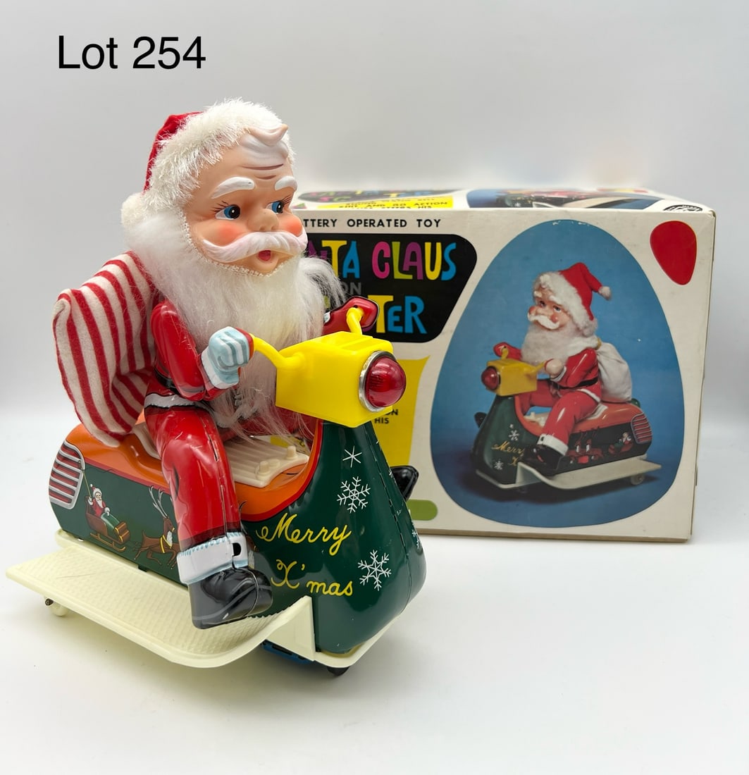 Mid Century Modern Toys Santa Claus on Scooter: Vintage Modern Toys Santa Claus on Scooter tin litho and plastic battery operated toy. Made in Japan. Comes with original box. Untested. Box measures 9 1/2" x 5" x 7 1/2".