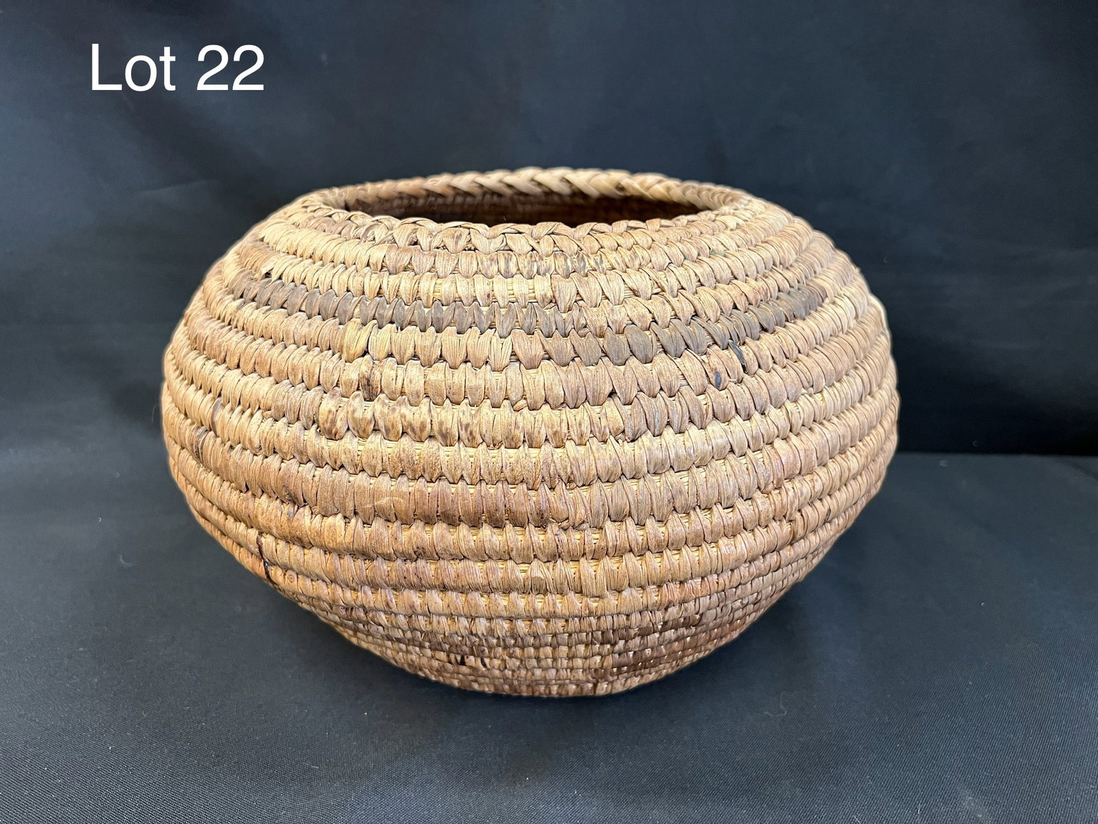 Vintage Coiled Basket: A vintage globular coiled basket. Shows age but in nice condition. 11" x 6 1/2".