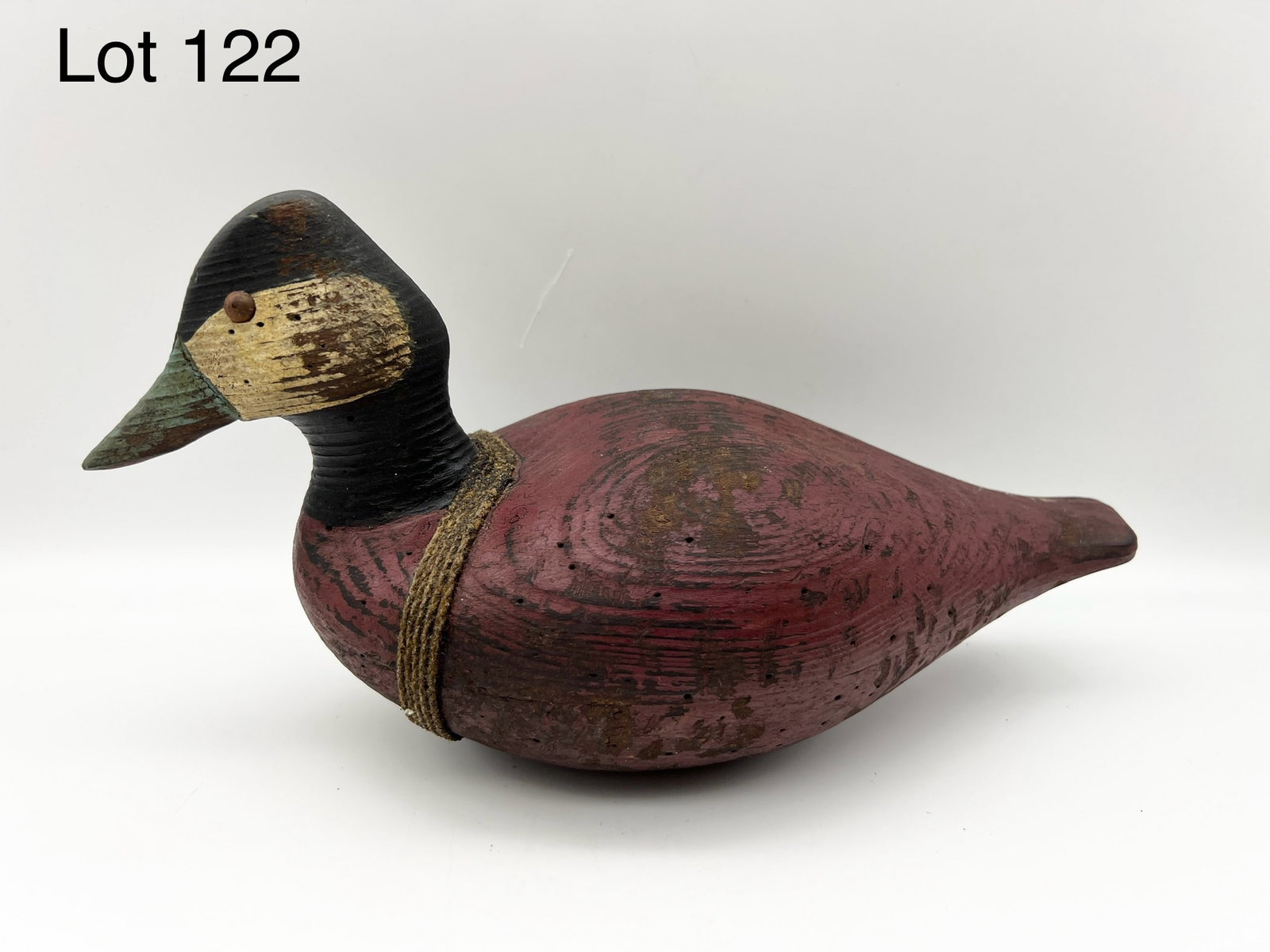 Signed SR White Ruddy Duck Drake Decoy: A signed SR White ruddy duck decoy. Has SR White signature rope wrapped around body and metal pin eyes. 11 1/2" long. *notes-worn paint
