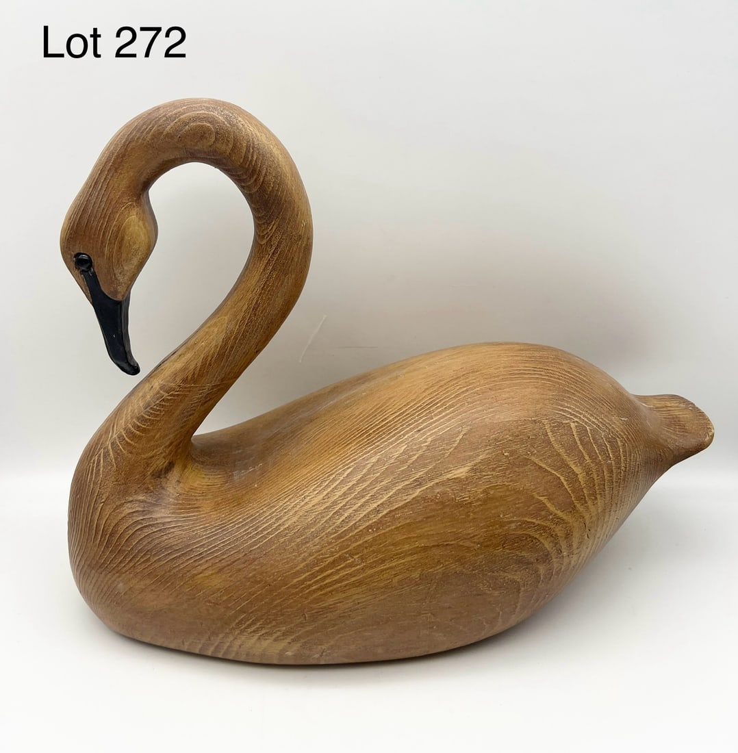 Carved Swan Decoy: A carved Swan decoy with natural wood finish. Has glass eyes and measures 14" long. *notes- light wear to wood
