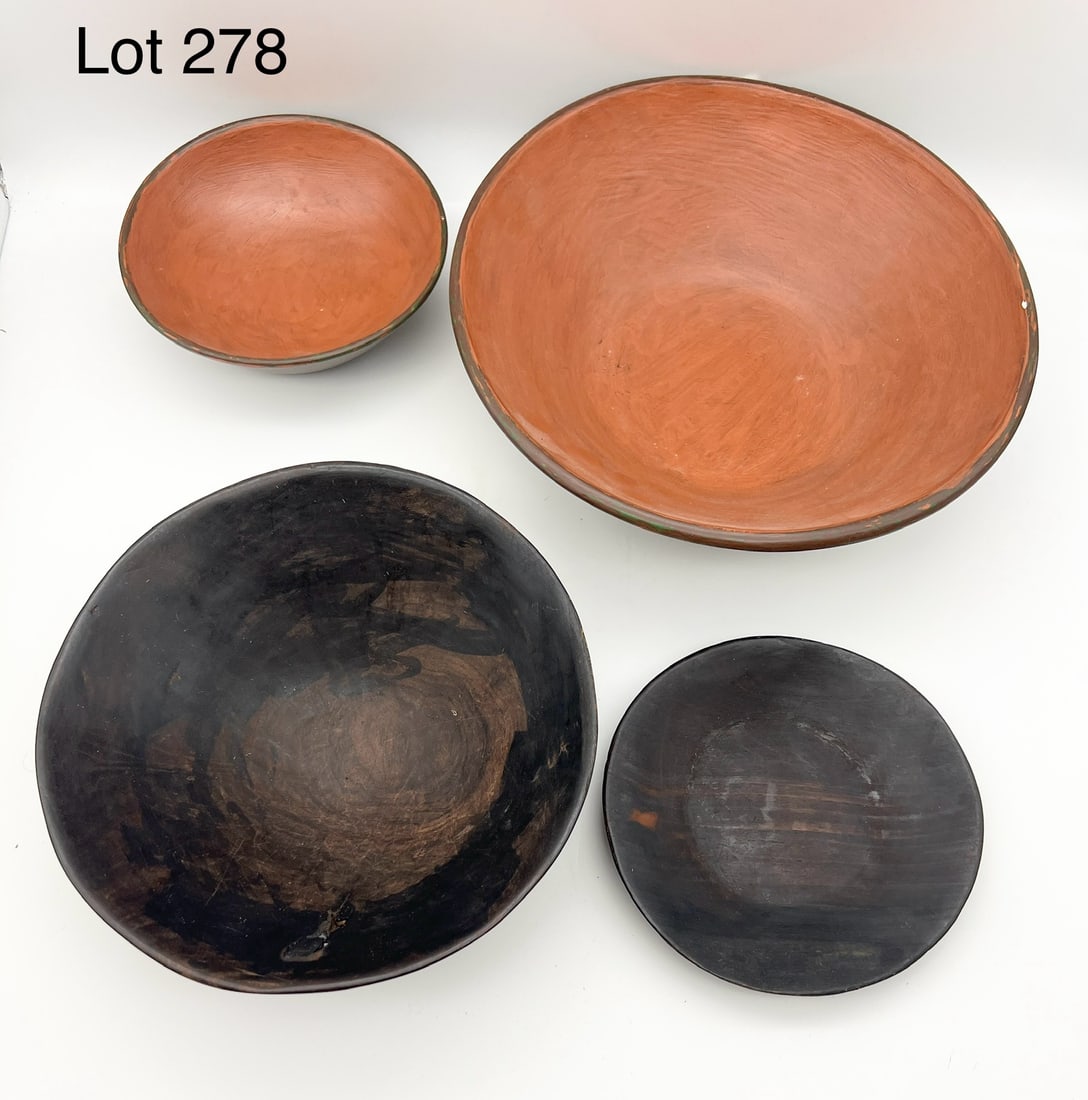 Collection of Handmade Wooden Bowls: A group of four handmade wooden bowls. Two are painted orange and green and the others have dark wood stain. Largest is 9" diameter. *notes- general wear.