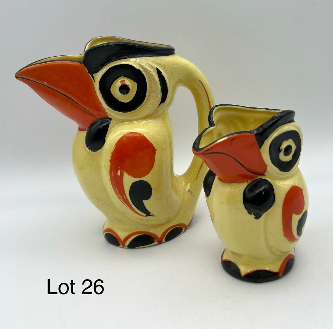 Pair of Vintage Ceramic Toucan Pitchers: Two vintage ceramic art-deco toucan pitchers, one larger than the other. Both made in Japan. Smaller measures 4 1/4", larger 6" *note - craquelure
