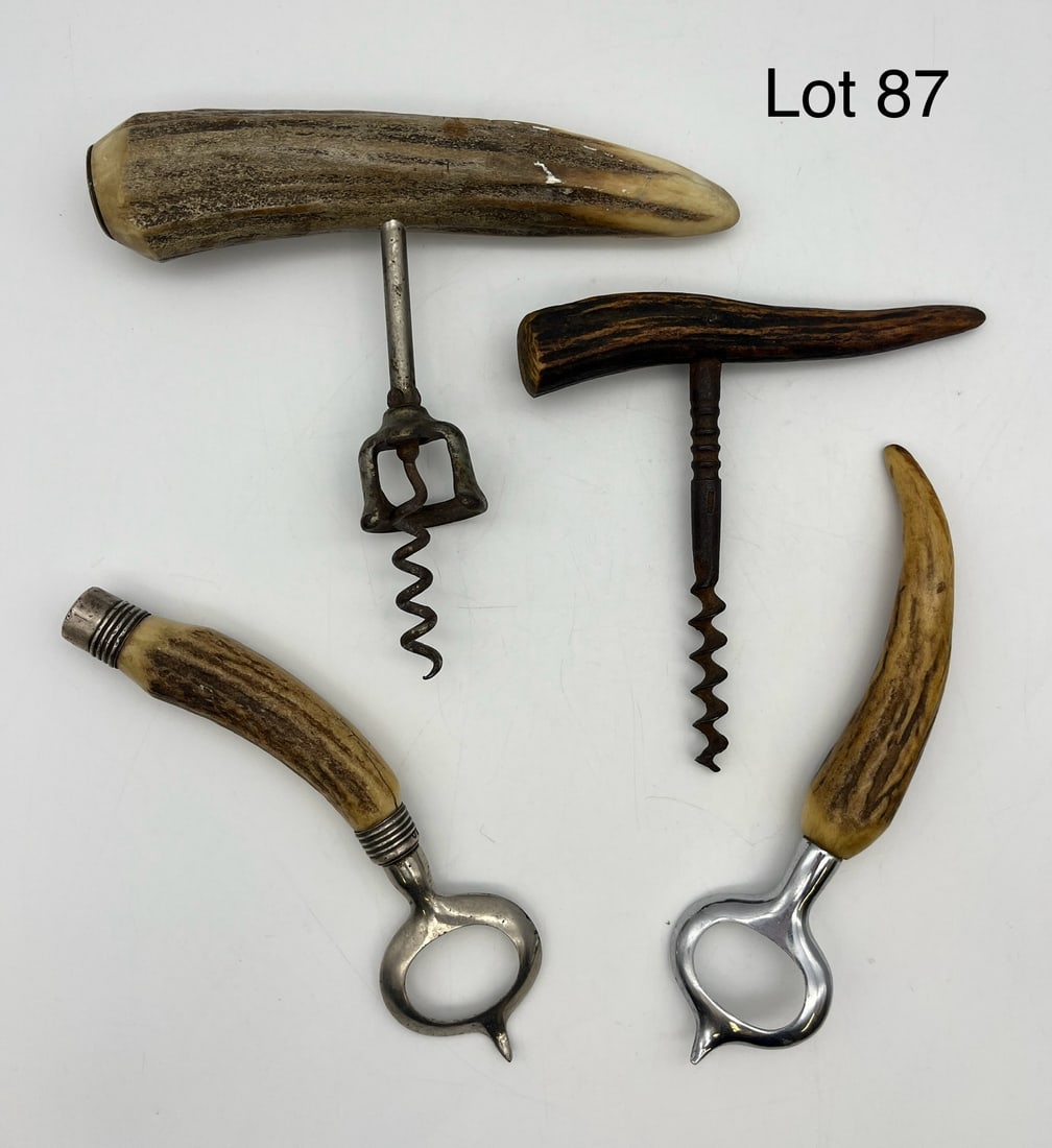 Collection of Vintage Antler Bottle Openers: A collection of four unique antler bottle openers including two corkscrews and two cap bottle openers, with one bottle opener showing sterling silver caps at either end. Varying sizes with overall goo