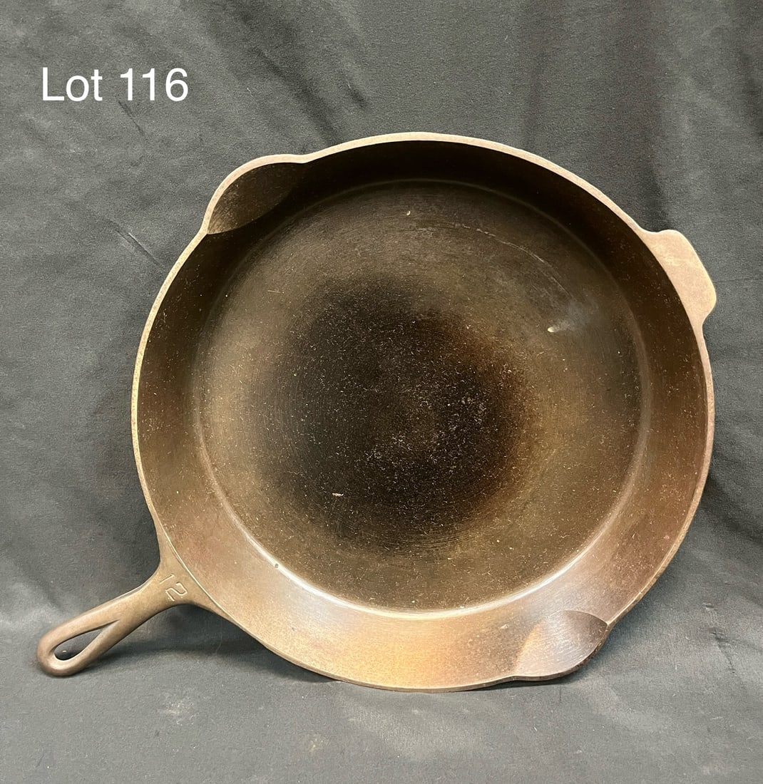 Griswold No. 12 Cast Iron Skillet: A No. 12 cast iron skillet pan from Griswold in very good condition. Makers marks underneath, marked from Erie, PA, 719-B. Measures 18 3/4" x 14"