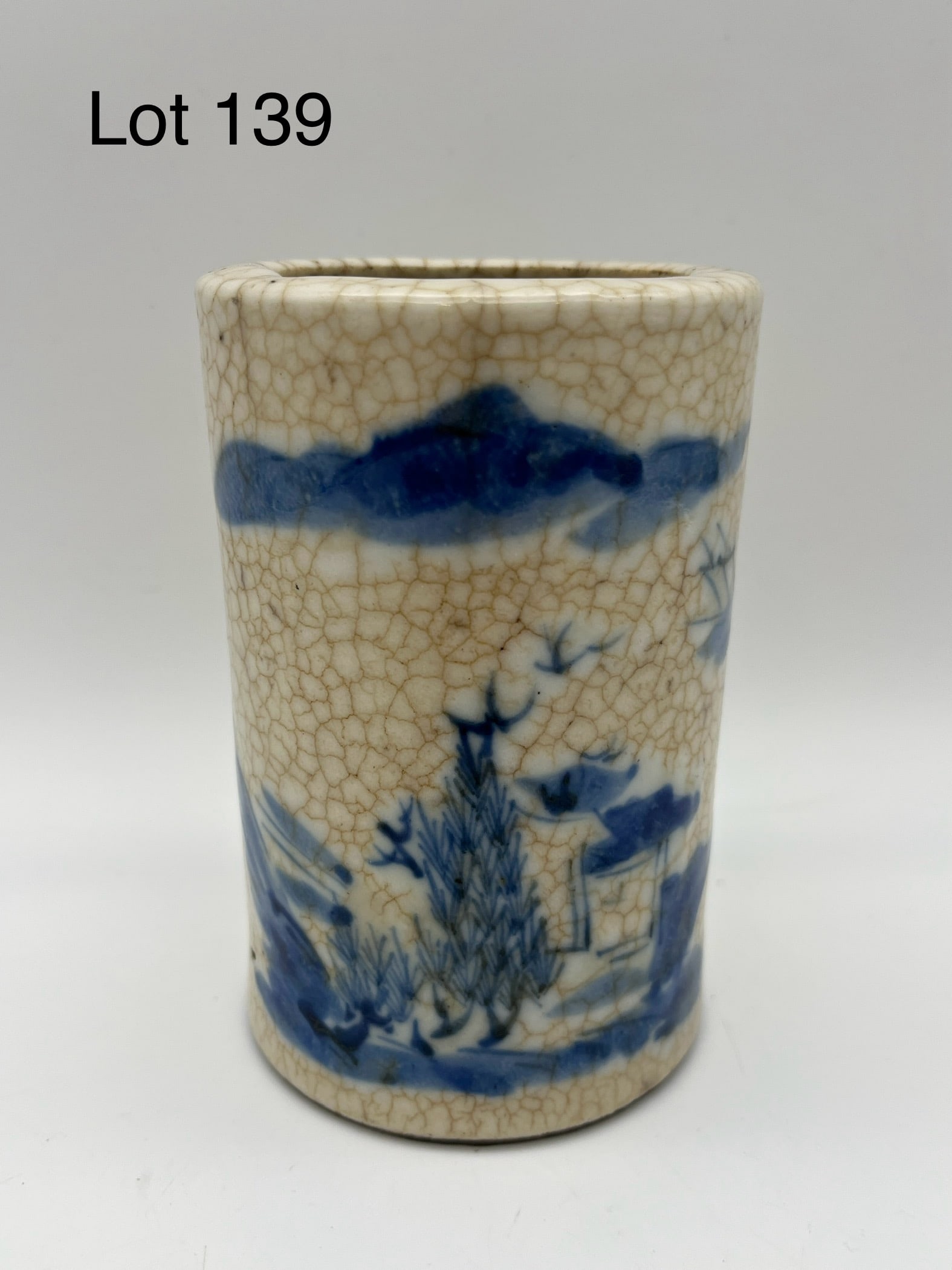 Antique Chinese Porcelain Brush Pot: A 19th c. Chinese porcelain brush pot, likely Qing Dynasty, with blue glaze nature scene at the face. No makers marks, measures 4 3/8" tall, 2 3/4" across. *note - no chips/cracks/repairs noted, crazi