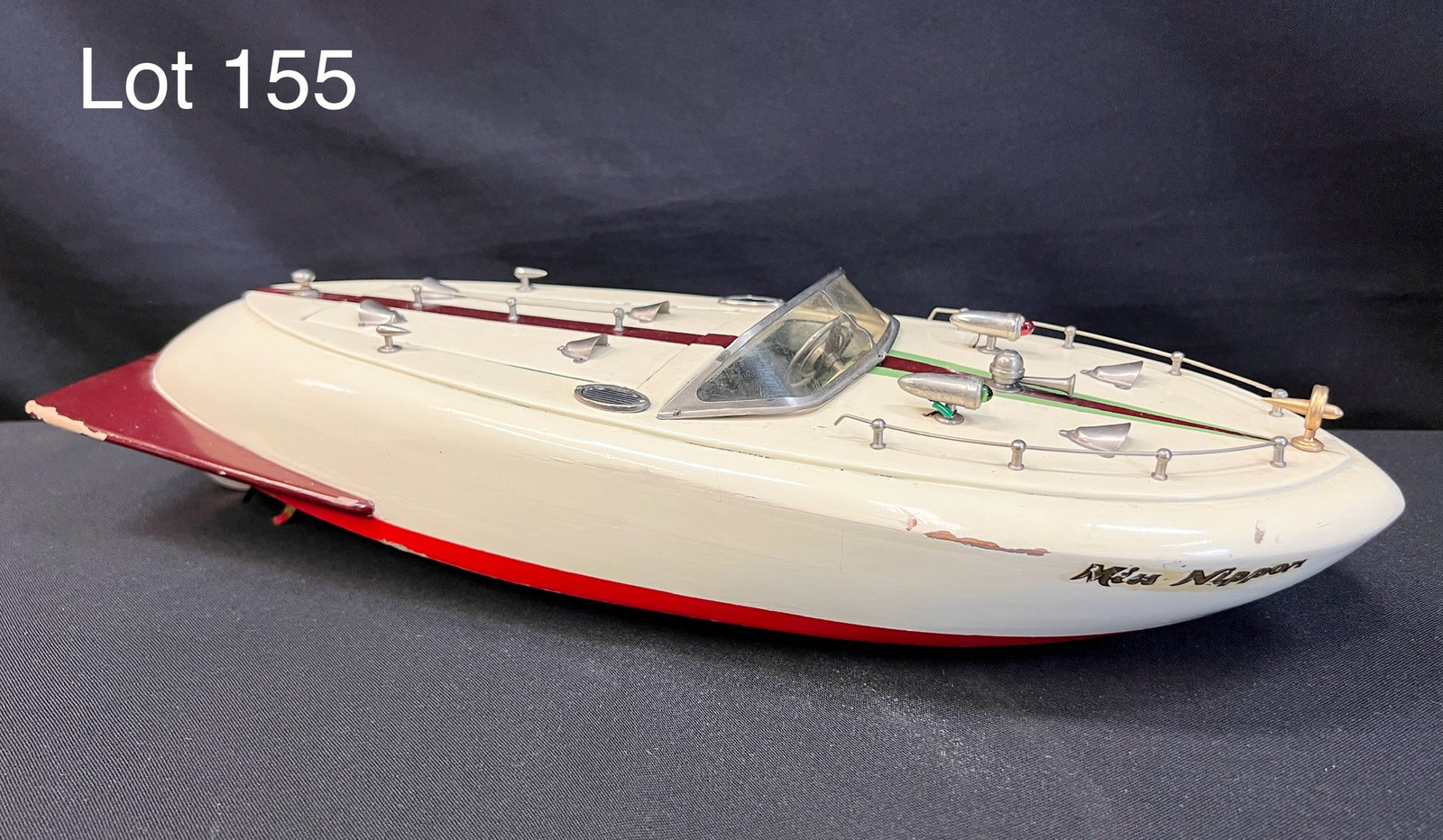 Mid Century TMY Japan "Miss Nippon" Speed Boat Toy: A 1950s TMY Japan "Miss Nippon" speed boat toy. Wood construction with inboard motor. 18" long. *notes- some small areas of paint loss.
