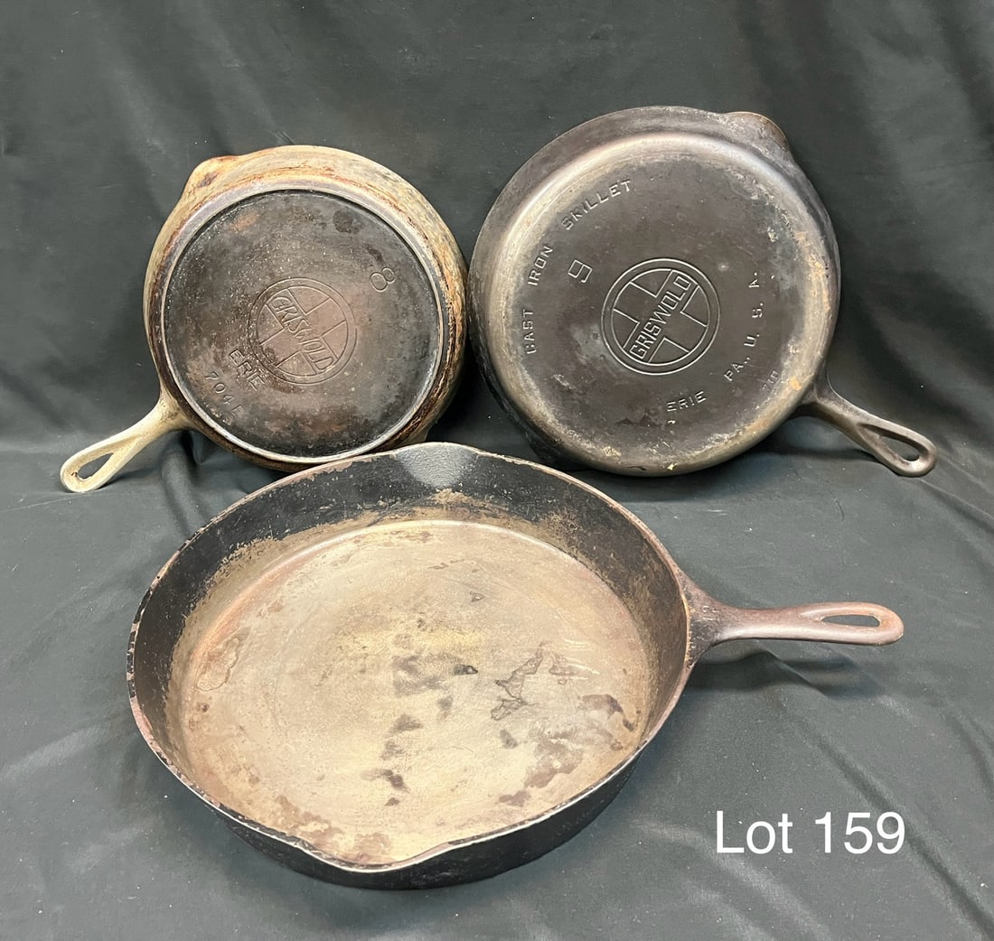 Trio of Cast Iron Skillets for Restoration Featuring Griswold: Three vintage cast iron skillets in need of restoration. Lot includes a Griswold No. 8 #704E, a Griswold No. 9 #710, and a large No. 12 Wagner Sidney #1062A. Varying states of condition, No. 12 measur