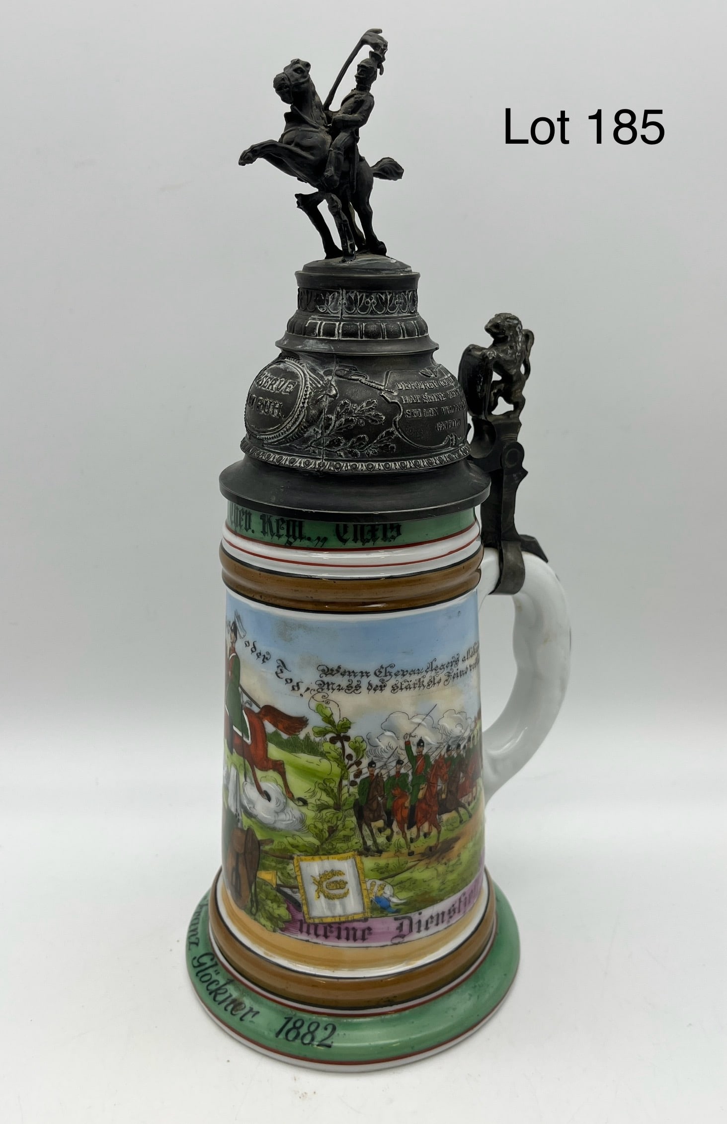 Antique German Regimental Beer Stein: An early 20th c. German regimental beer stein, likely cavalry, with pewter lid and lithophane base. German inscriptions throughout stein and lid, marked "1880 Frans Glockner 1882". Measures 11 1/2" ta