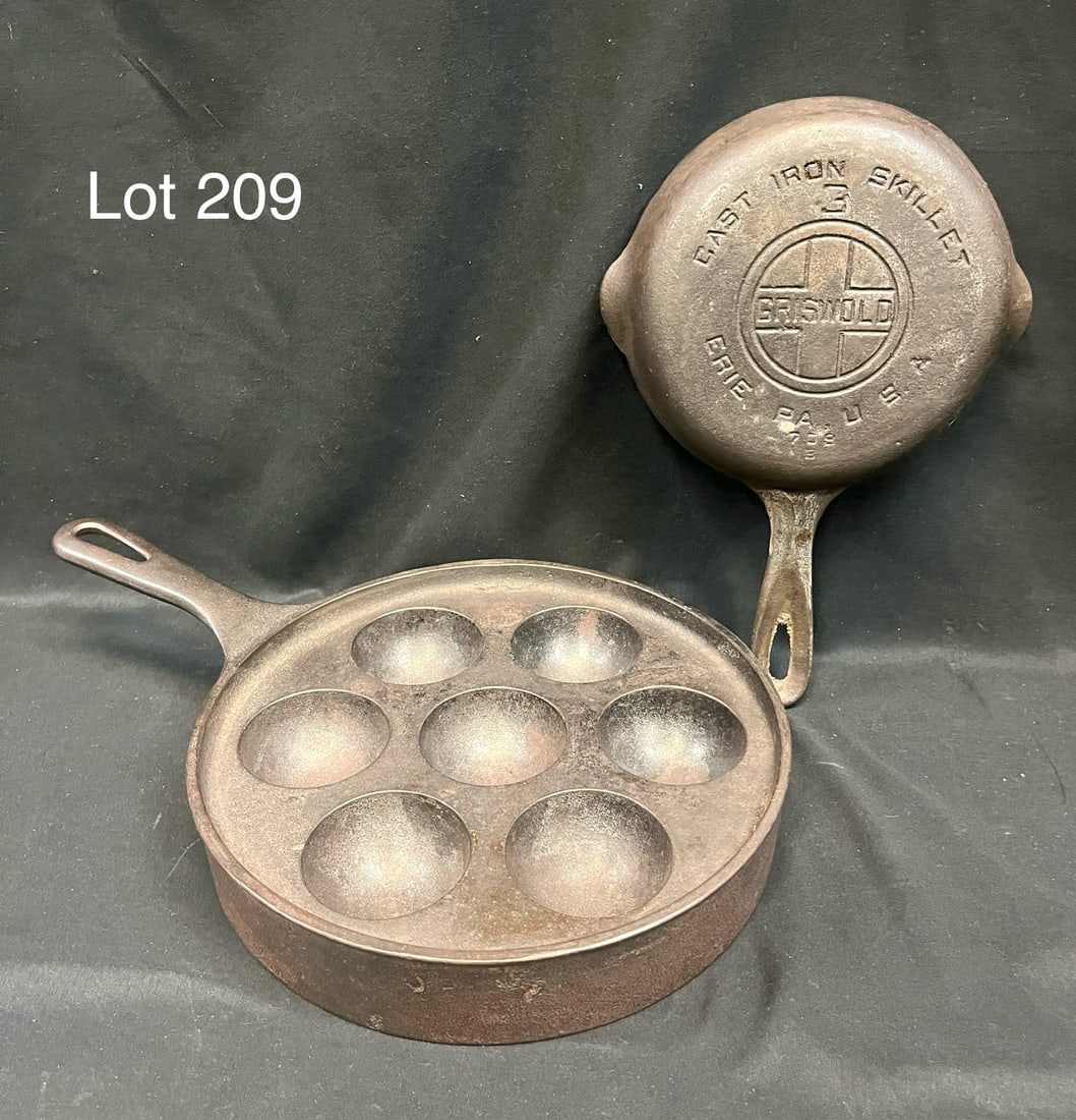 Lot of Griswold Cast Iron Cookware: Two pieces of vintage Griswold cast iron cookware, including a No. 32 Aebleskiver pan (#962) and a No. 3 skillet (#709B). No. 32 measures 9 1/4" x 14" *note - patina