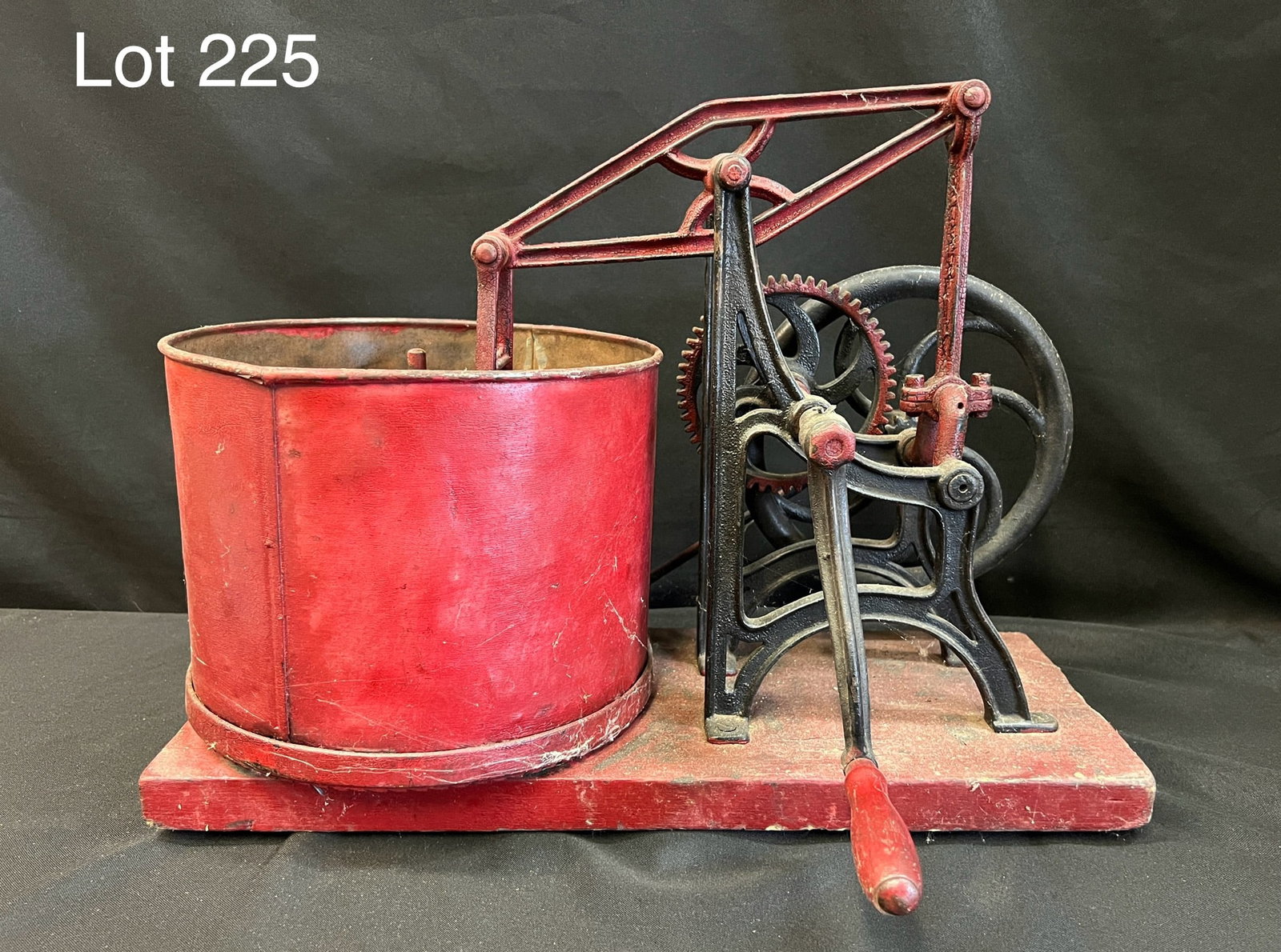 19th Century Starrett Food Chopper: A 19th century primitive Starrett cast iron hand crank food chopper. Painted red and sits on a wood base. Dimensions are 16" x 13" x 12". *notes- wear/patina from age.