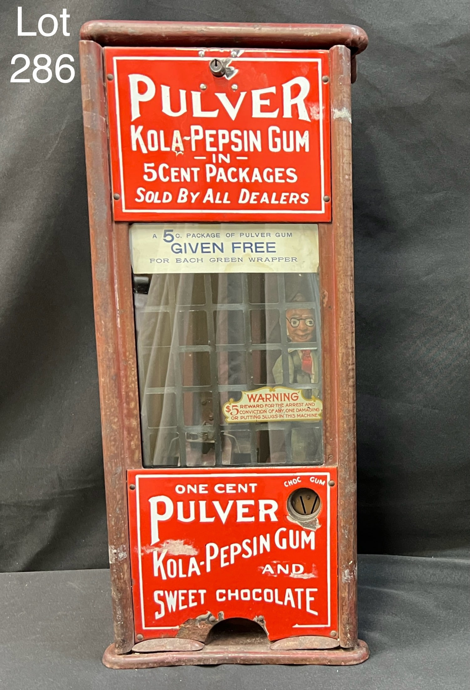 Early 20th Century 1 Cent Pulver Kola-Pepsin Gum and Sweet Chocolate Machine: 1920s/1930s 1 Cent Pulver Kola-Pepsin Gum and Sweet Chocolate Dispensing Machine. Dimensions are 24" x 10" x 5 1/2". *notes- patina/wear, has some replacement screws and adhesive residue.