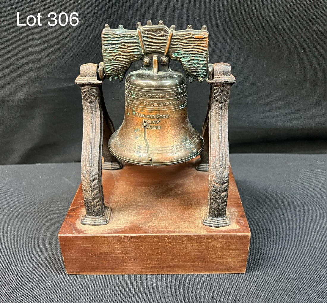 Vintage Liberty Bell Cast Metal Replica: A vintage liberty bell cast metal replica on wood base. Measures 8" tall. *notes- patina/wear