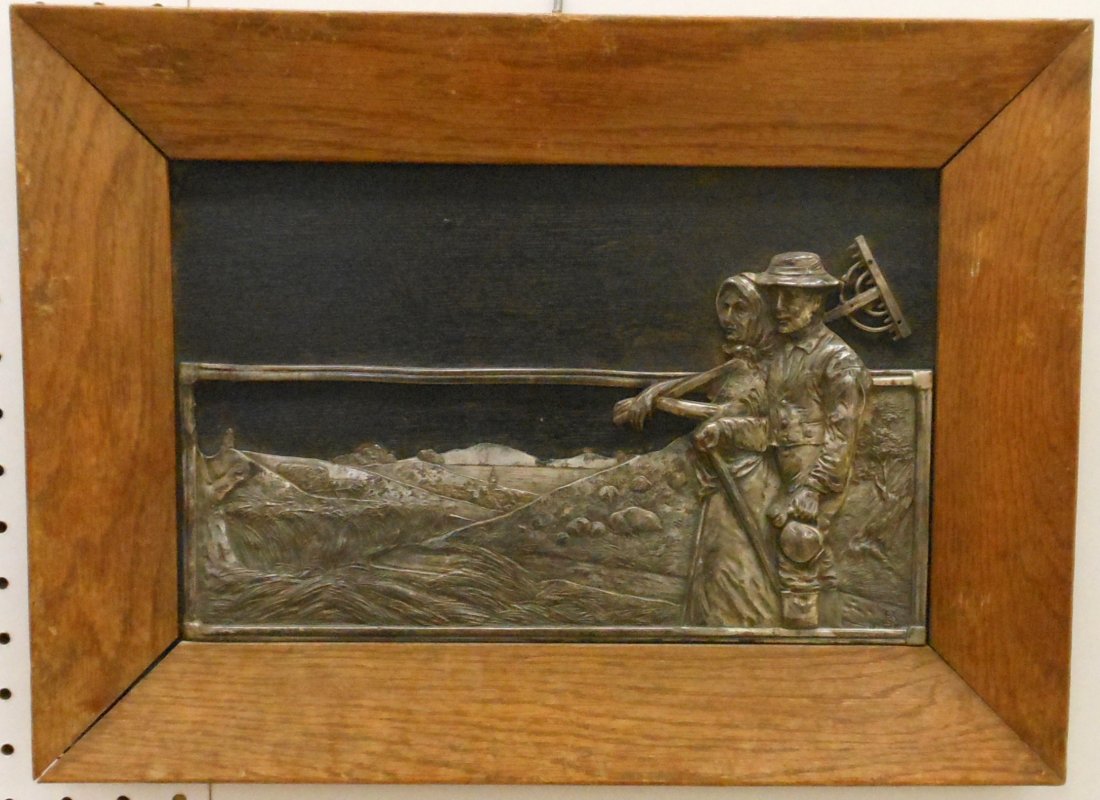 Signed WPA Framed Metal Work: 7" X 13" in a 13" X 18" wood frame, Lancaster PA Dutch man and woman farmers standing in a field, hay wagon and Village with a church in the back ground, handwriting in pencil on the reverse, metal wo