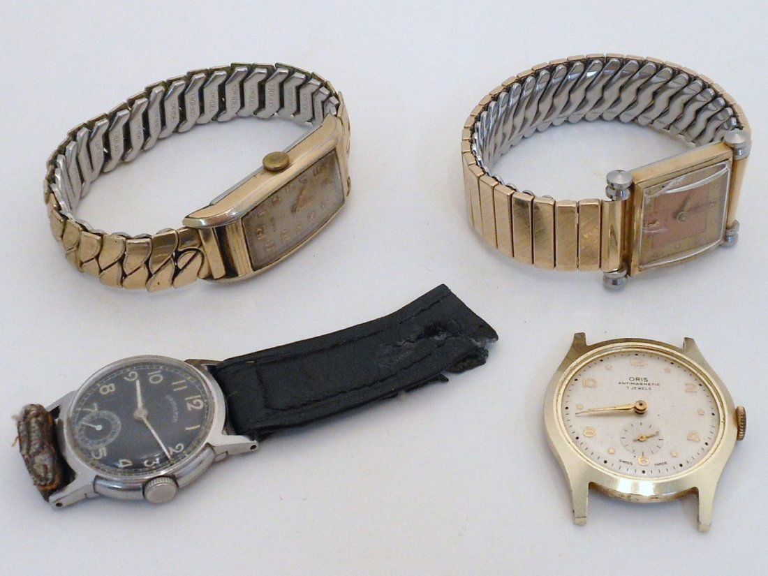 Lot of Men's Wristwatches: Lot of four. Oris seven jewel Swiss made men watch with no band, missing crystal, working used condition. Hamilton black face watch with only part of a band, crystal is hazy, working used condition. S