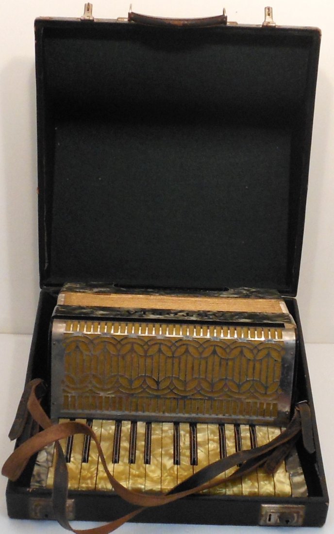 Astoria Piano Accordion with Hard Case: Piano accordion marked Astoria?, 12 bass and 25 treble keys, this starter piano accordion has a faux pearl finish, in great working condition. Locking case but no key.