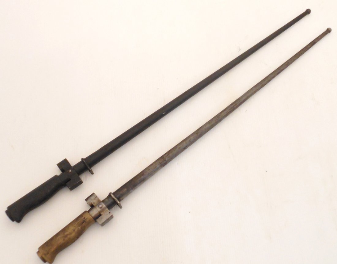 Pair of French 1886/93/16 Lebel Bayonet w/ Scabbard: 25 1/4" total with a 20 1/2" blade, French Model 1886 Lebel Infantry Bayonet, blade is nothing more than a pig-sticker a straight 4-edged-blade (cruciform) with 4 full-length fullers. One has a brass 