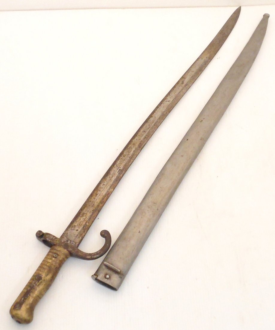 Egyptian Yataghan Type Bayonet w/ Scabbard: 27 1/4" total 22 1/4" blade and a 5" hilt, Egyptian Yataghan Type Bayonet fits model 1869 rifle, brass handle and curved long blade, shows age with rust and pitting, marked on blade and crossguard, go
