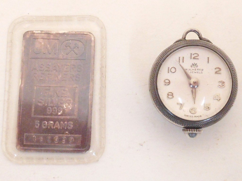 Bucherer Watch Pendant & 5 Grams Silver Bar: Bucherer 17 Jewels Watch Pendant. JM Assayers Refiners 999 Fine Silver 5 Gram Bar. Watch is not Working.