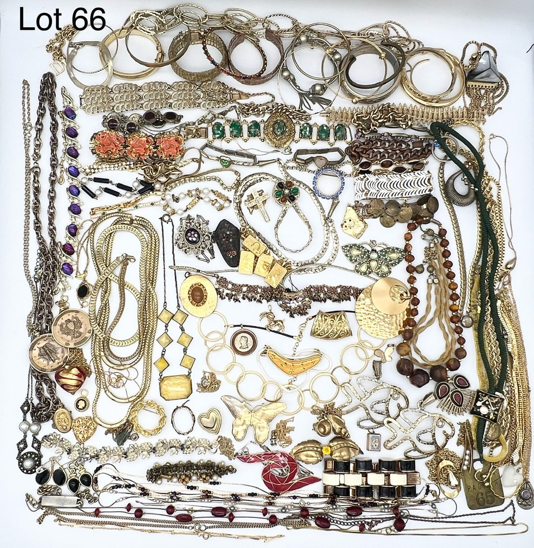 Selection of Gold Toned Costume Jewelry: An elegant selection of gold toned costume jewelry. Includes many bangle and cuff bracelets, oversized pendants, antique style pieces and much more.