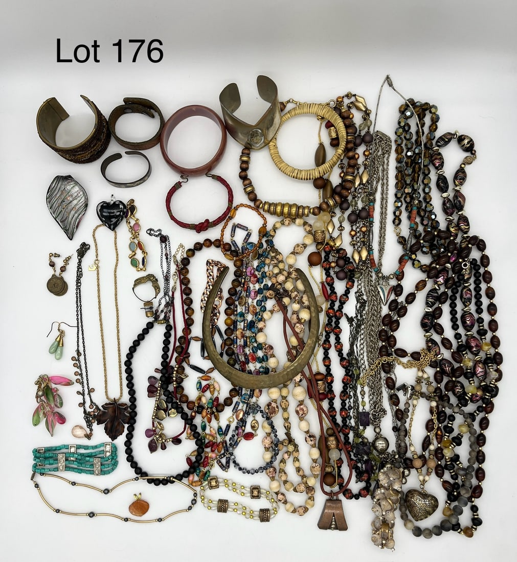 Lot of Bohemian Style Costume Jewelry: Bohemian style costume jewelry lot featuring colorful beads and unique materials like glass, copper, and more. Shows bracelets, necklaces, earrings, pendants, and brooches