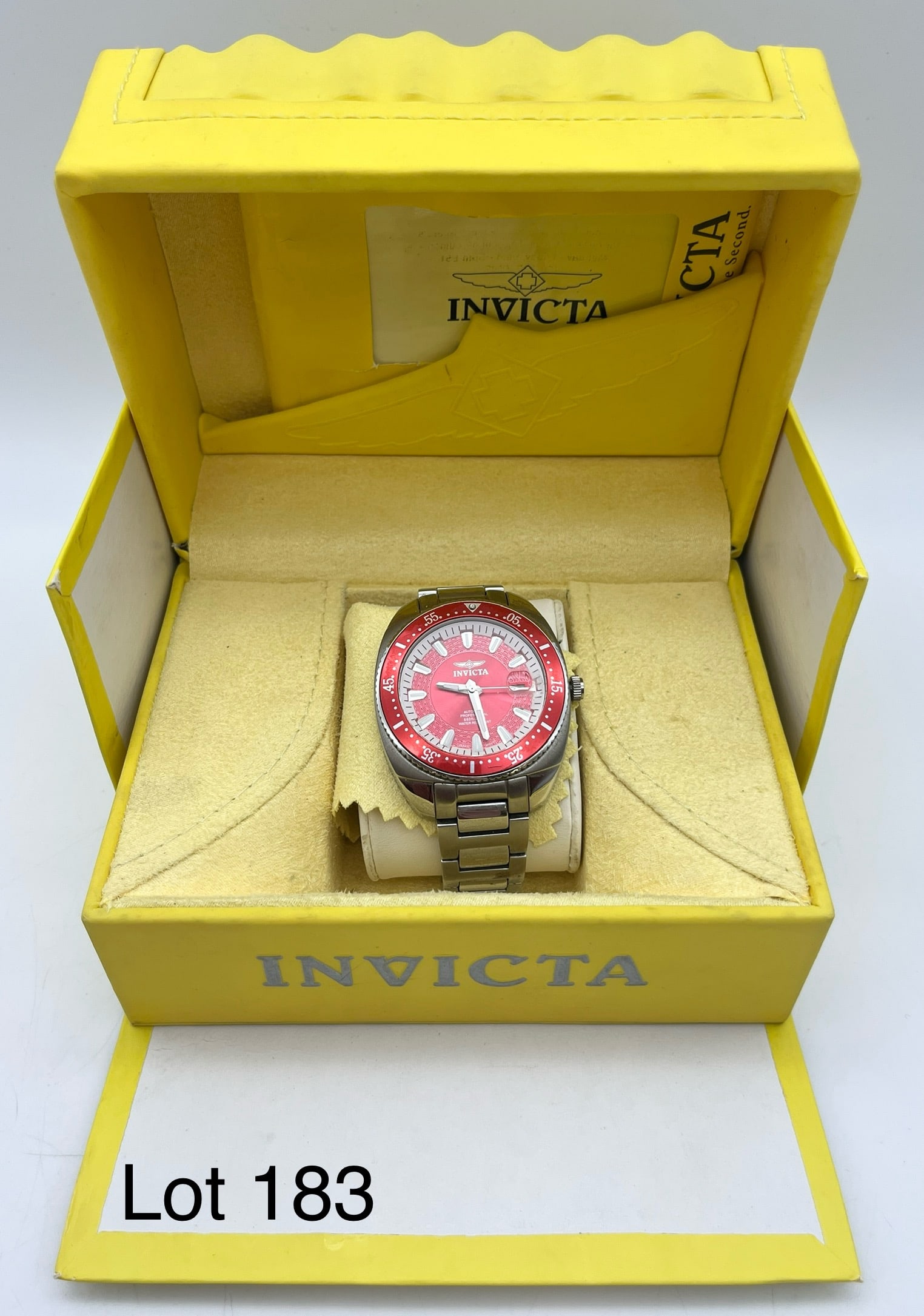 Invicta Men's Pro Divers Watch: An Invicta 3883 Pro Diver Men's Watch in red and silver tones. Automatic movement, stainless steel band, functions well, comes in original box.