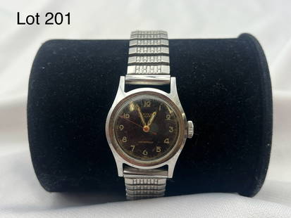 Vintage Doxa Swiss Watch: A vintage Doxa black face men's watch with swiss movement, stretch band.