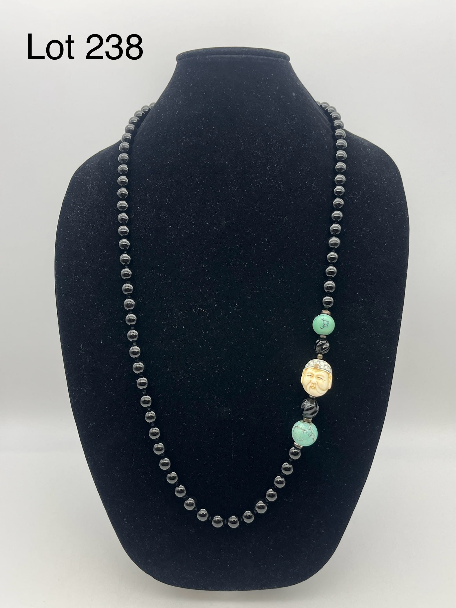 Antique Black Onyx and Turquoise Necklace W/ Carved Bone Netsuke: An antique black onyx bead necklace with turquoise and carved bone netsuke of an elderly man.