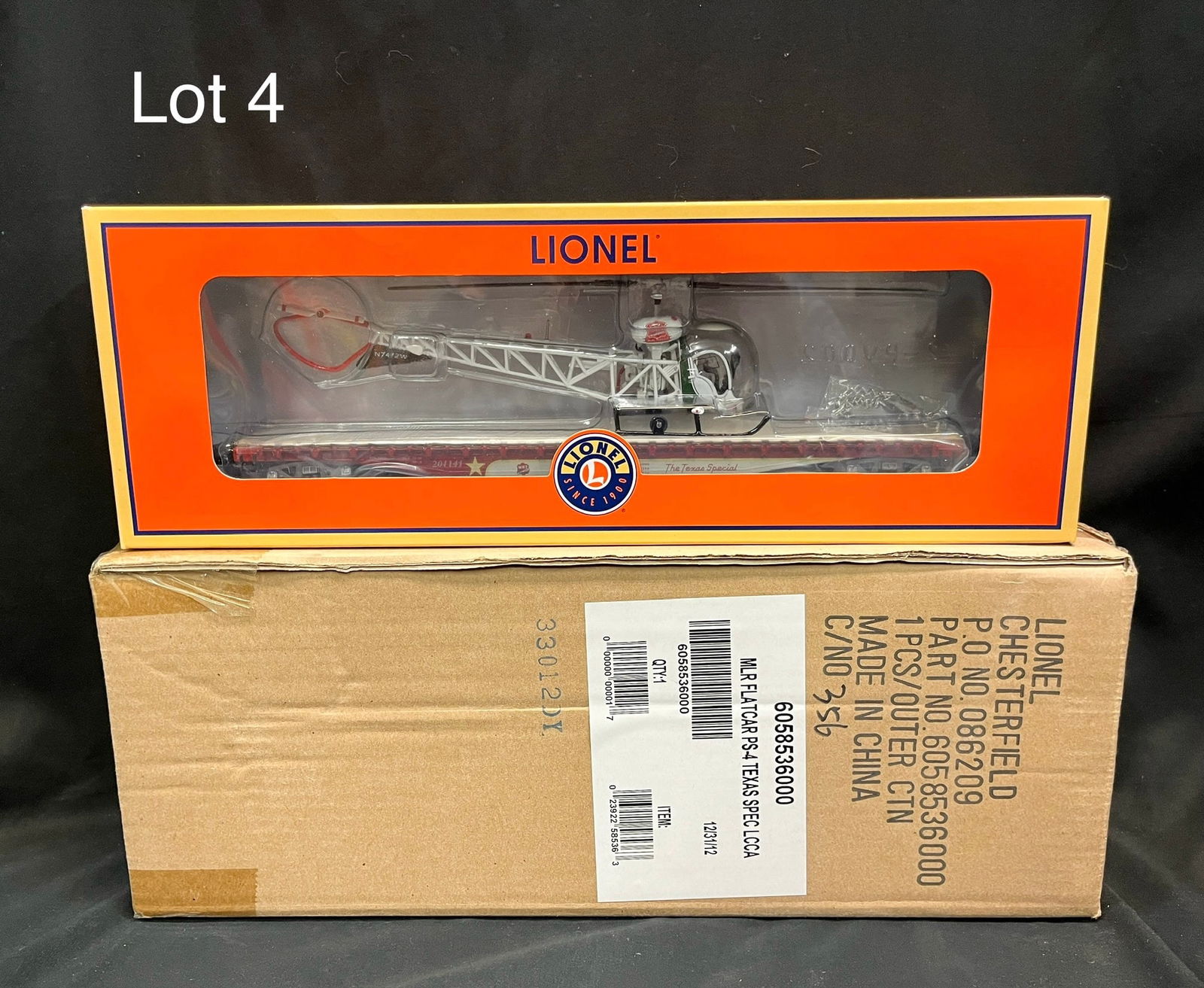 Mint Condition Lionel O-Gauge 6-58536 'Texas Special' Flatcar w/ Helicopter: A Lionel O-Gauge 6-58536 LCCA MLR 'Texas Special' PS-4 flatcar w/ helicopter. Piece in mint condition, never opened and provided with original shipping box.