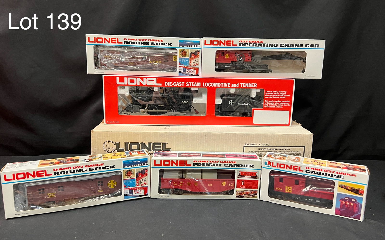 1986 Lionel Trains 27 Gauge Service Station Special Santa Fe Work Train Set: A 1986 Lionel Trains Service Station Special Santa Fe Work Train set. Includes 27 gauge die-cast metal A.T.S.F. Steam Switcher Locomotive and Tender (6-8635), gondola (6-6272), bunk car (6-5745), work