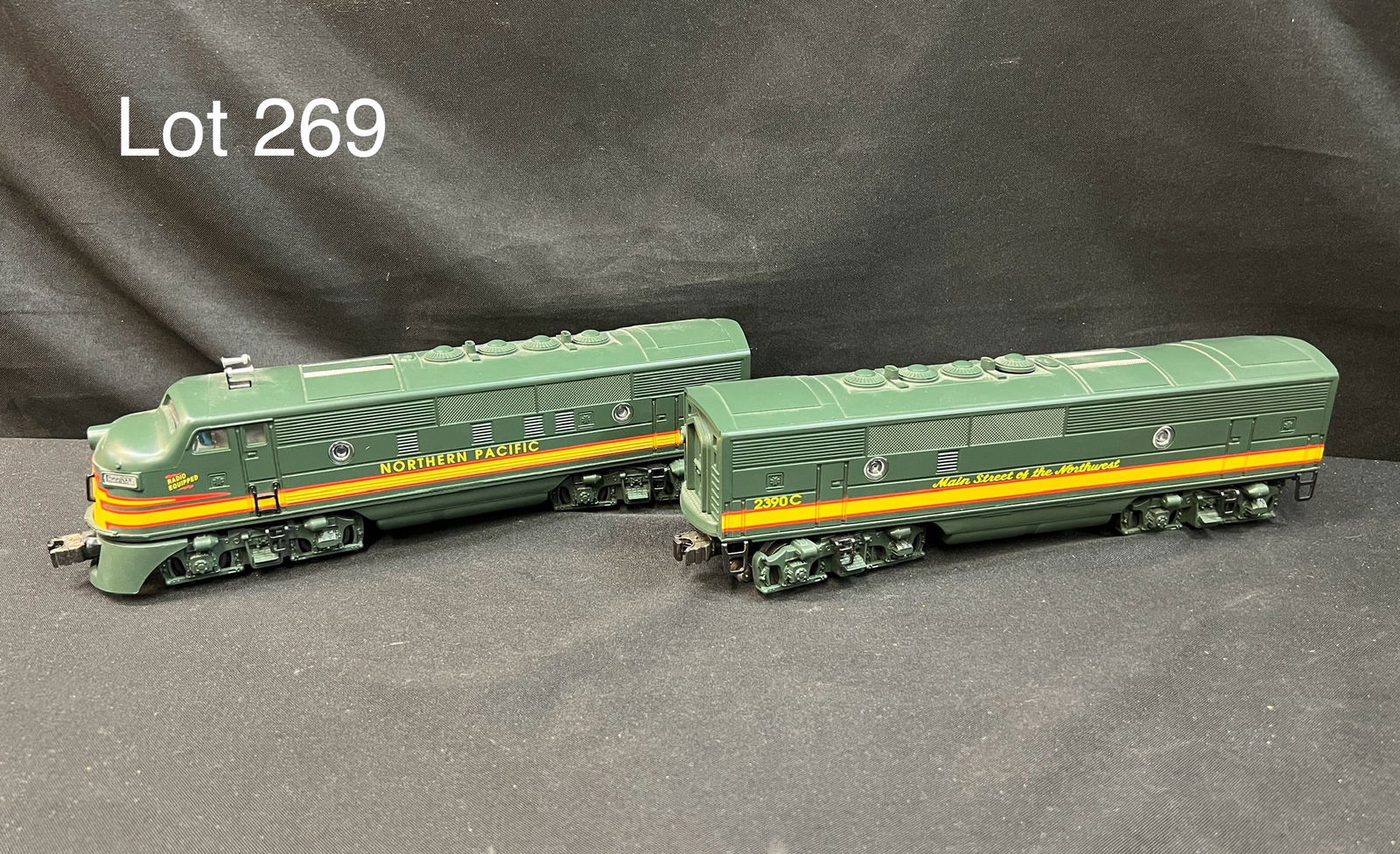 Lionel 2390A/2390B Northern Pacific Diesel Locomotive Set: Lionel Trains o-gauge 2390A and 2390C Northern Pacific diesel locomotive and non powered locomotive set. Both are in used condition with mild wear.