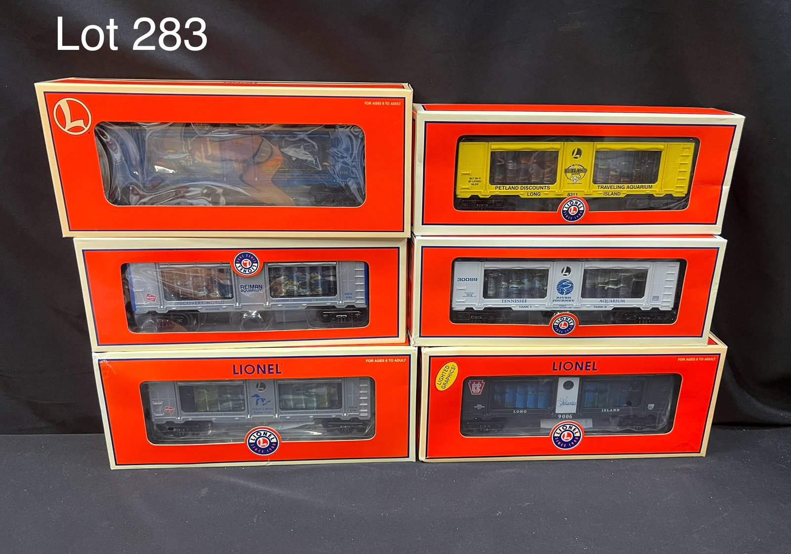 Selection of Lionel O-Gauge Aquarium Cars: Group of 6 Lionel o-gauge aquarium cars. Includes Reiman Aquarium saltwater Caribbean car (6-52572), a Railroad Museum of Long Island Atlantis Marine World aquarium car (6-52433), an Atlantis aquarium