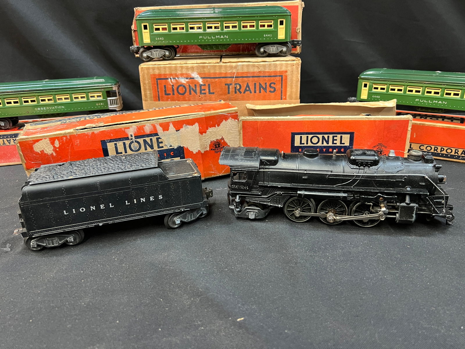 Lionel Trains Reading T-1 4-8-4 Steam Locomotive and Tender: Lionel Trains Reading T-1 4-8-4 steam locomotive and tender. Runs on 042 or wider track. New in box. Box measures 33" long. *notes- some wear on box.